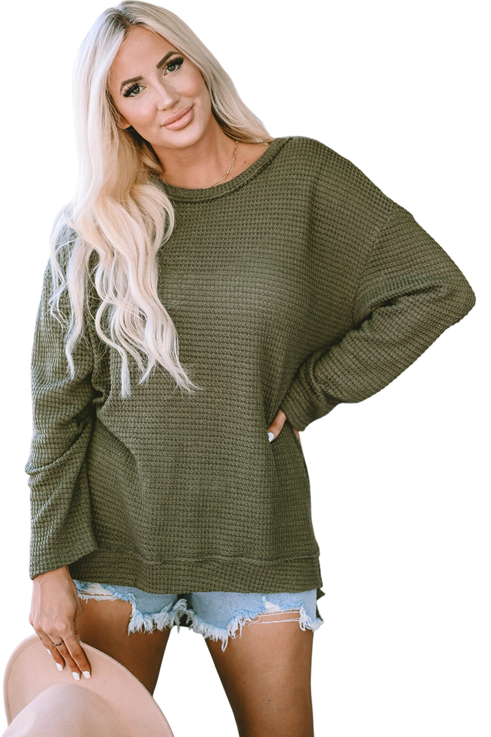 Green waffle knit oversized long sleeve top with high slits from ModestAndDevoted, featuring a relaxed fit and textured fabric.
