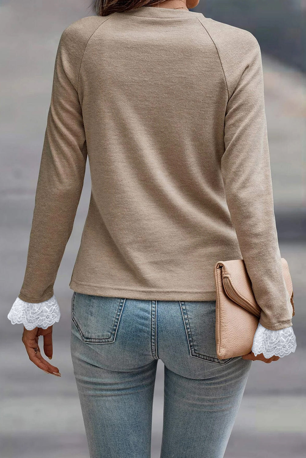 Long sleeve raglan top by ModestAndDevoted with parchment seam detail, lace contrast cuffs, made of polyester, viscose, and elastane.