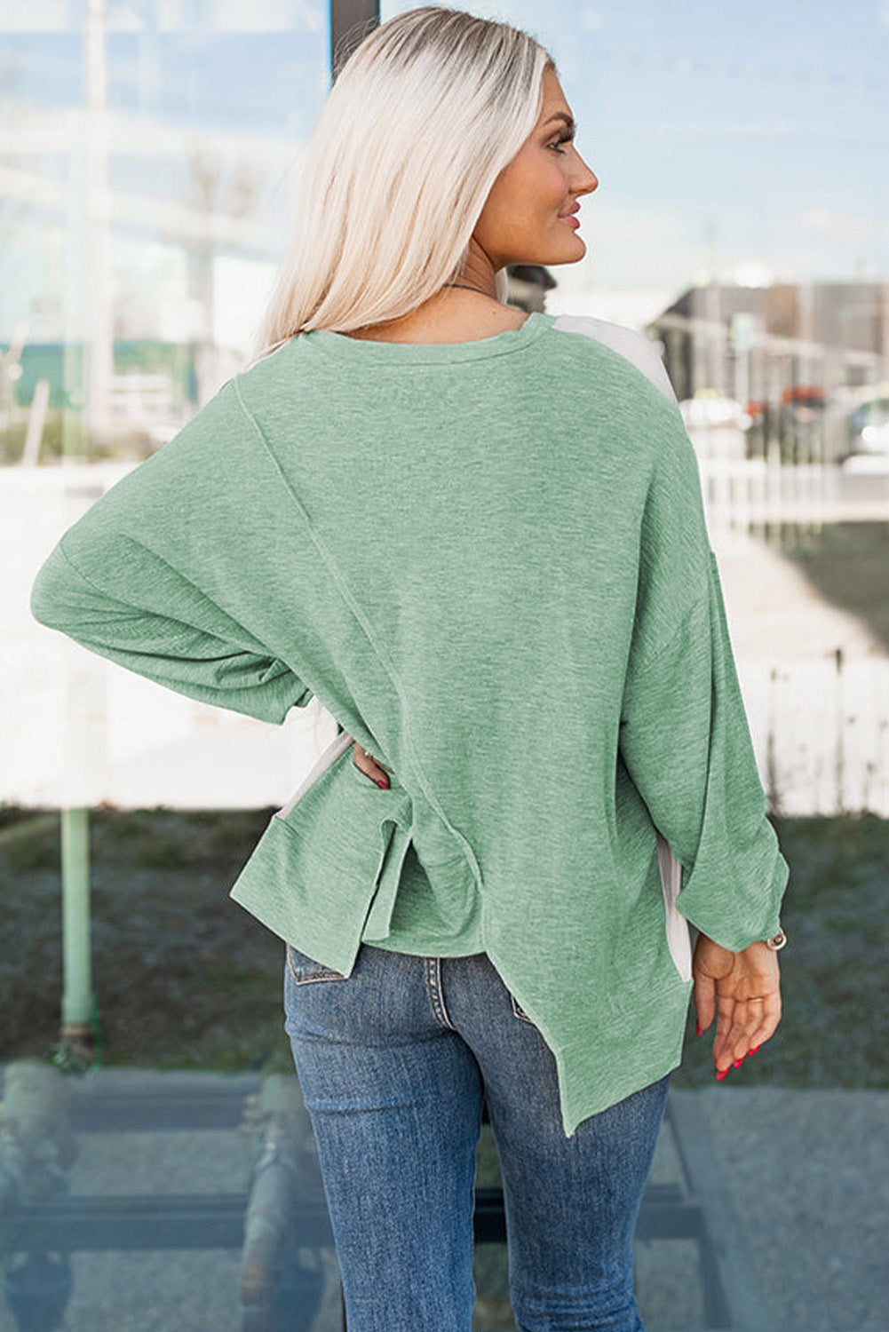 Rose pink long sleeve top by ModestAndDevoted with colorblock stitching and irregular hem, made of polyester, cotton, and elastane.
