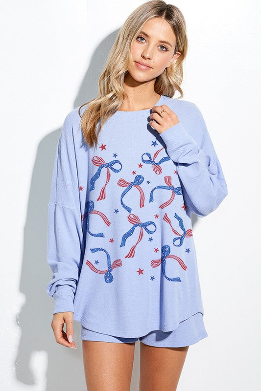 ModestAndDevoted patriotic long sleeve top with a bow, featuring a blue design for comfortable, stylish wear.