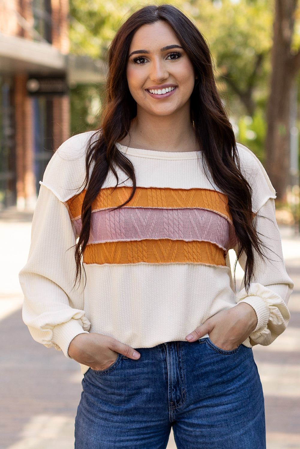 White corded exposed seam knit patchwork long sleeve top by ModestAndDevoted, featuring drop sleeves and a stylish, textured design.