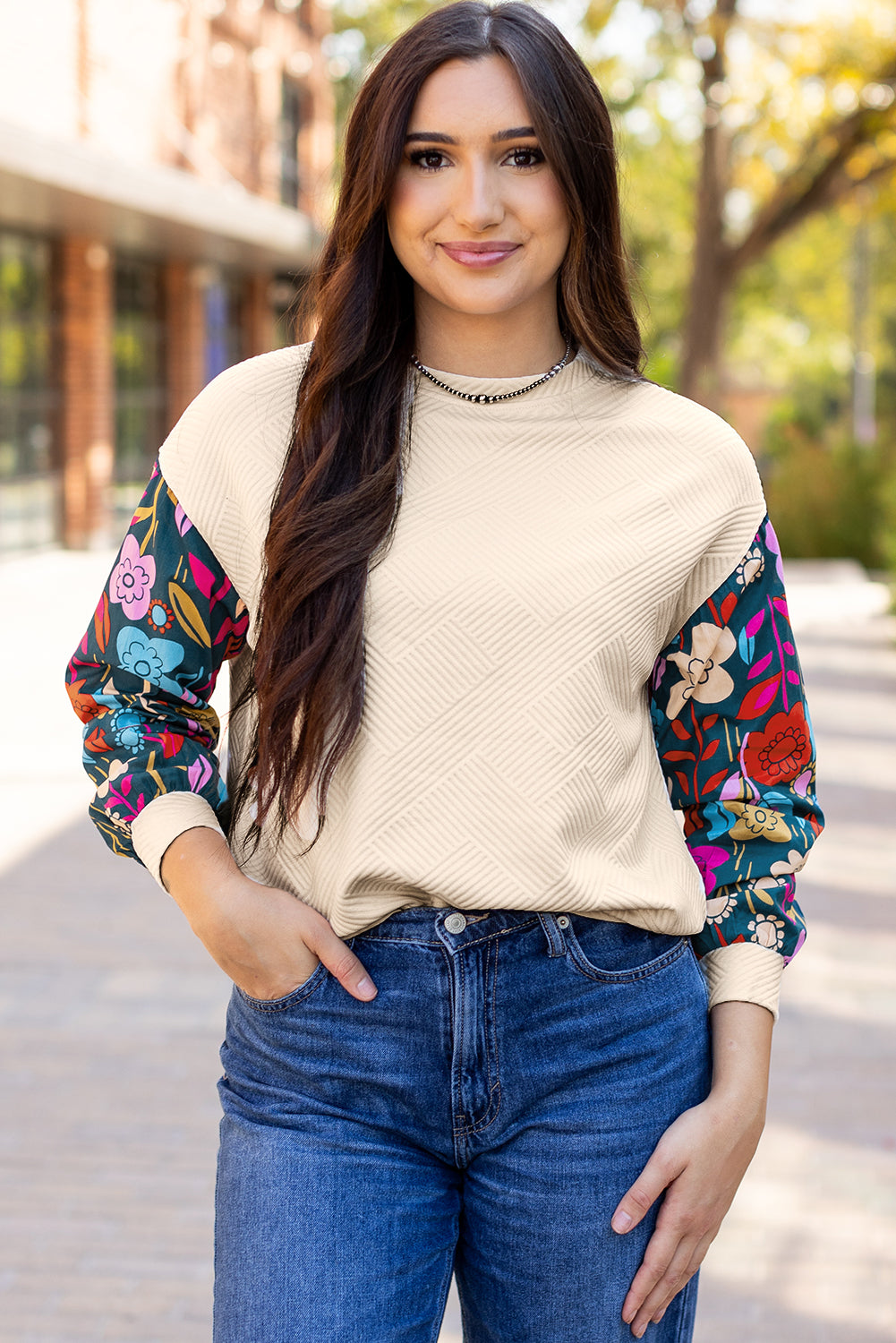 White contrast floral sleeve textured drop shoulder knit top by ModestAndDevoted, featuring long sleeves and a stylish textured design.