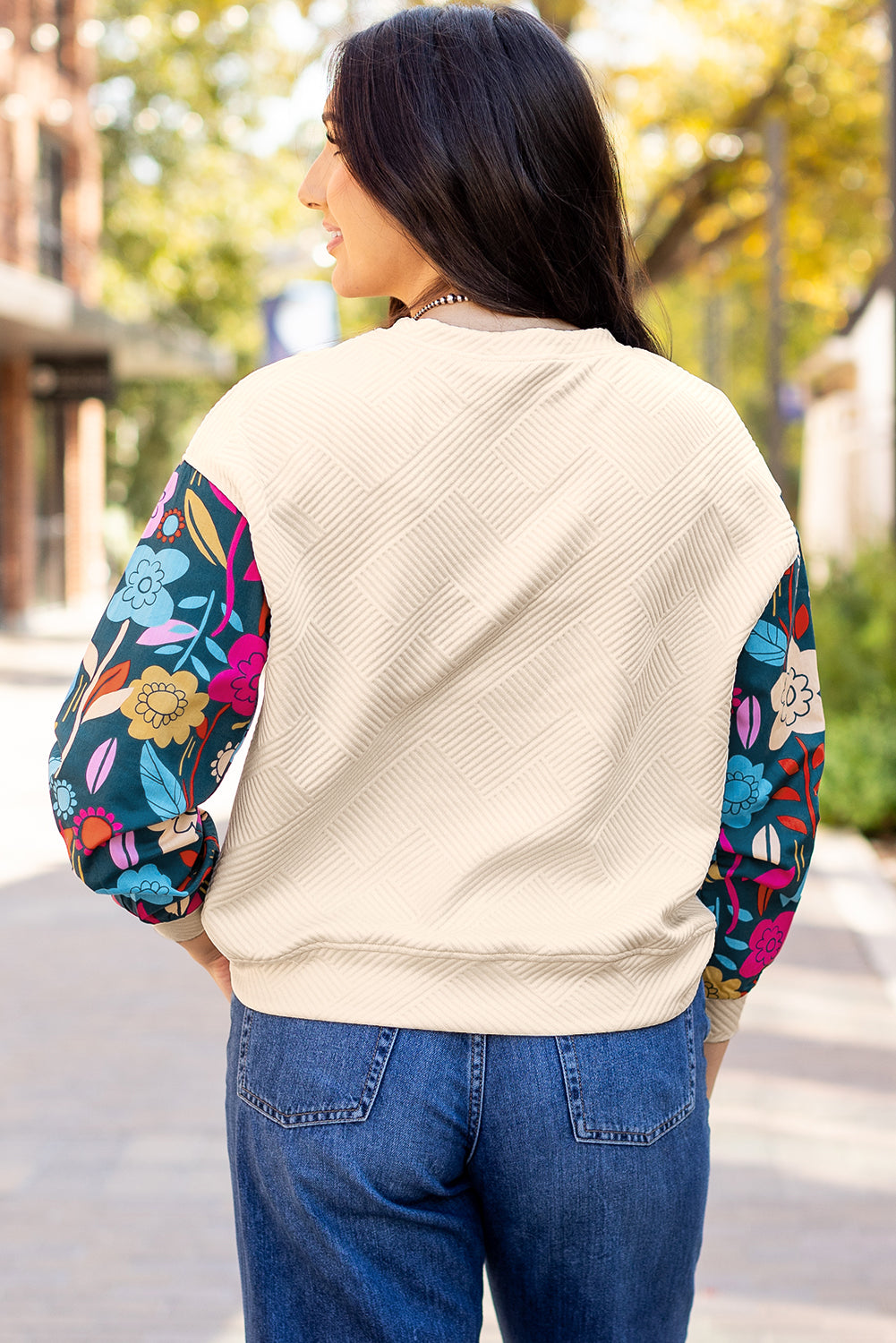 White contrast floral sleeve textured drop shoulder knit top by ModestAndDevoted, featuring long sleeves and a stylish knit design.