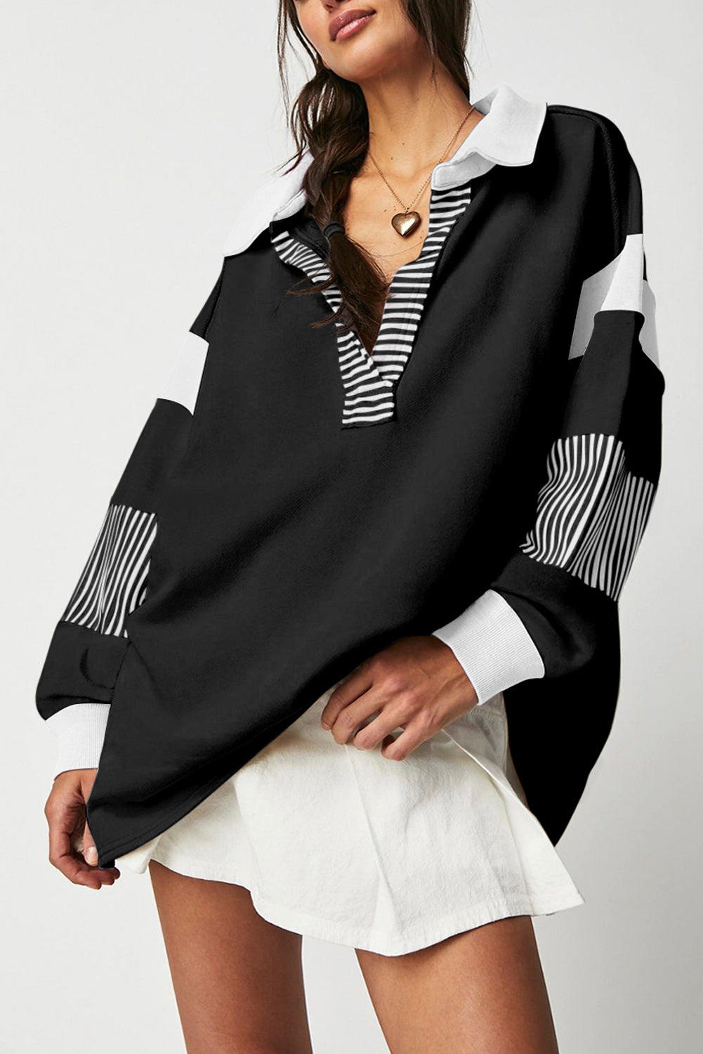 Black striped colorblock patchwork collar sweatshirt from ModestAndDevoted, featuring a casual hoodie design with contrasting panels.