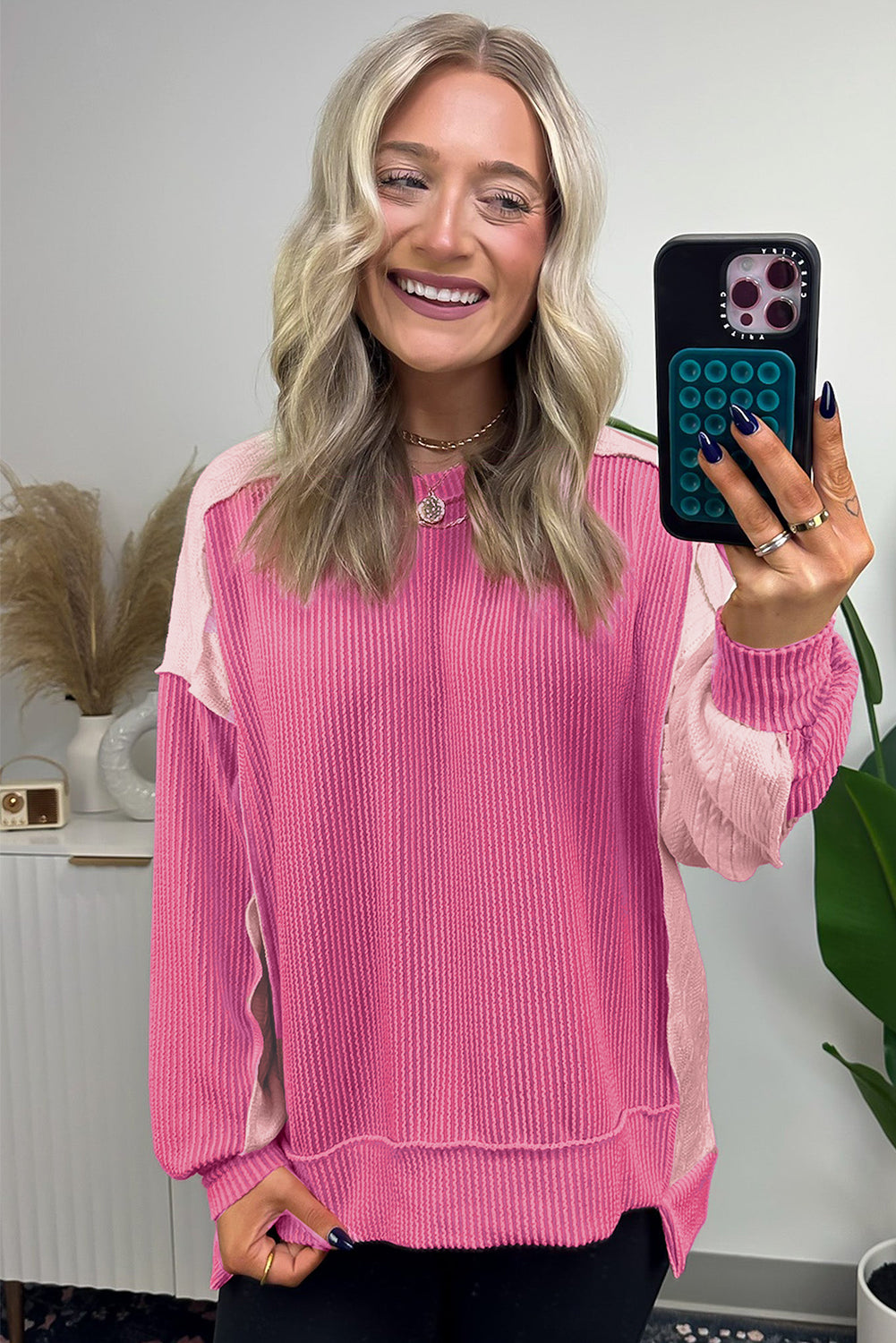 ModestAndDevoted Bonbon cable knit colorblock sweatshirt with exposed seams, featuring a cozy, stylish design in soft fabric blend.