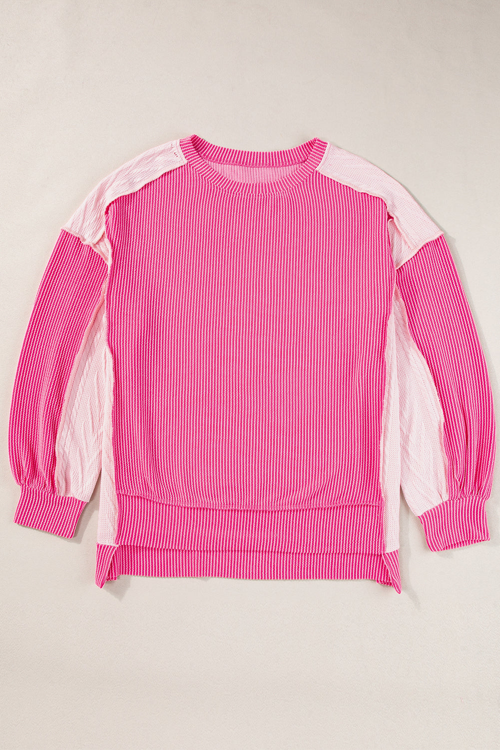 ModestAndDevoted Bonbon cable knit colorblock sweatshirt with exposed seams, featuring a cozy, stylish design in a soft fabric blend.
