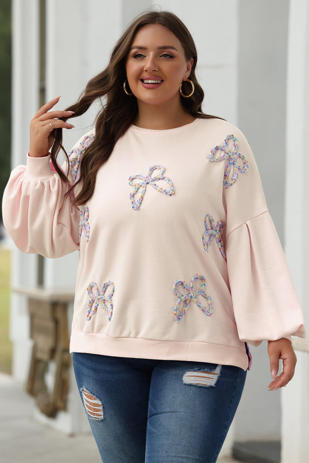 Light pink embroidered bow lantern sleeve oversized sweatshirt by ModestAndDevoted, featuring a cozy pullover design with stylish details.