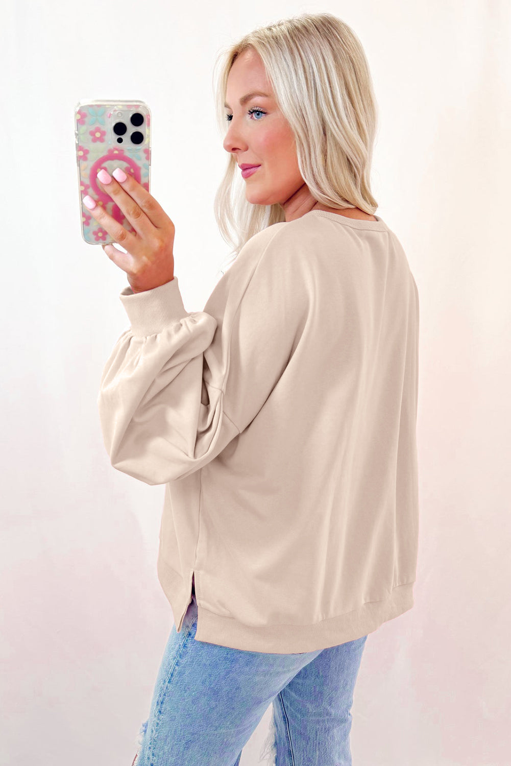 Light pink embroidered bow lantern sleeve oversized sweatshirt from ModestAndDevoted, featuring a relaxed fit and soft fabric.