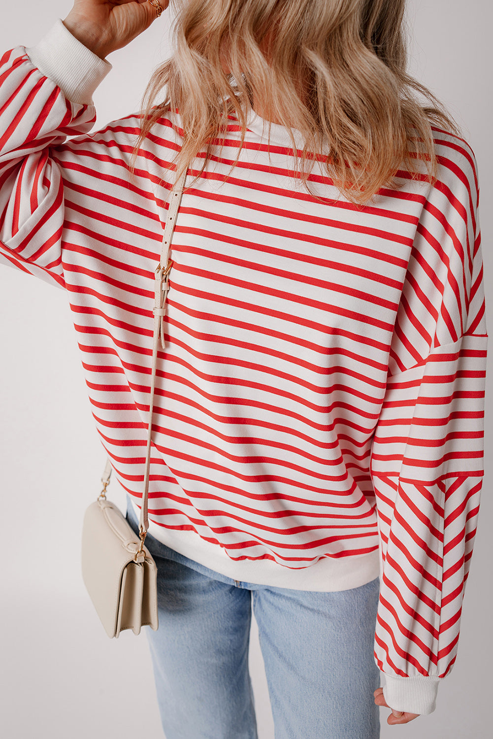 Orange stripe drop shoulder crew neck sweatshirt by ModestAndDevoted, featuring a loose fit and soft polyester-cotton blend fabric.