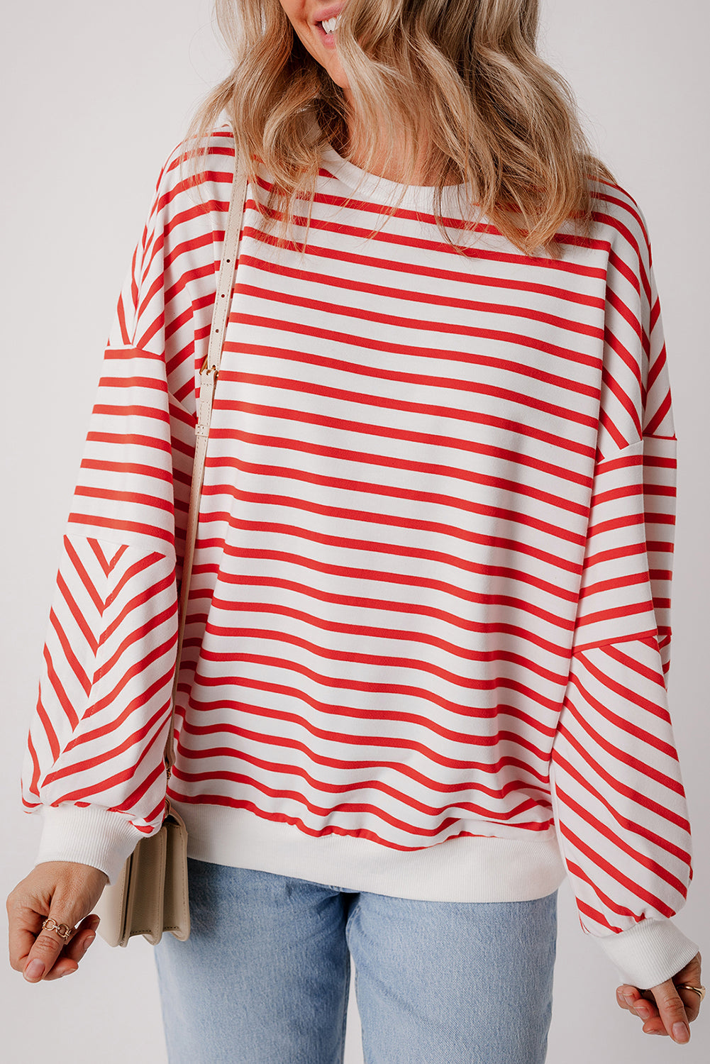 Orange stripe drop shoulder crew neck sweatshirt by ModestAndDevoted, loose fit with polyester, cotton, and elastane fabric.