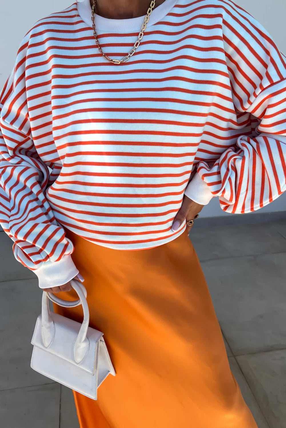 Orange stripe drop shoulder crew neck sweatshirt from ModestAndDevoted, featuring a loose fit, polyester cotton blend, and stylish design.