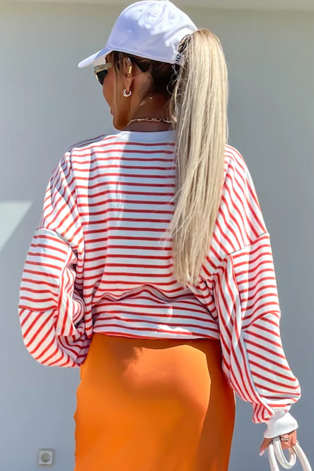 Orange stripe drop shoulder crew neck sweatshirt by ModestAndDevoted, featuring a loose fit, polyester, cotton, and elastane blend.