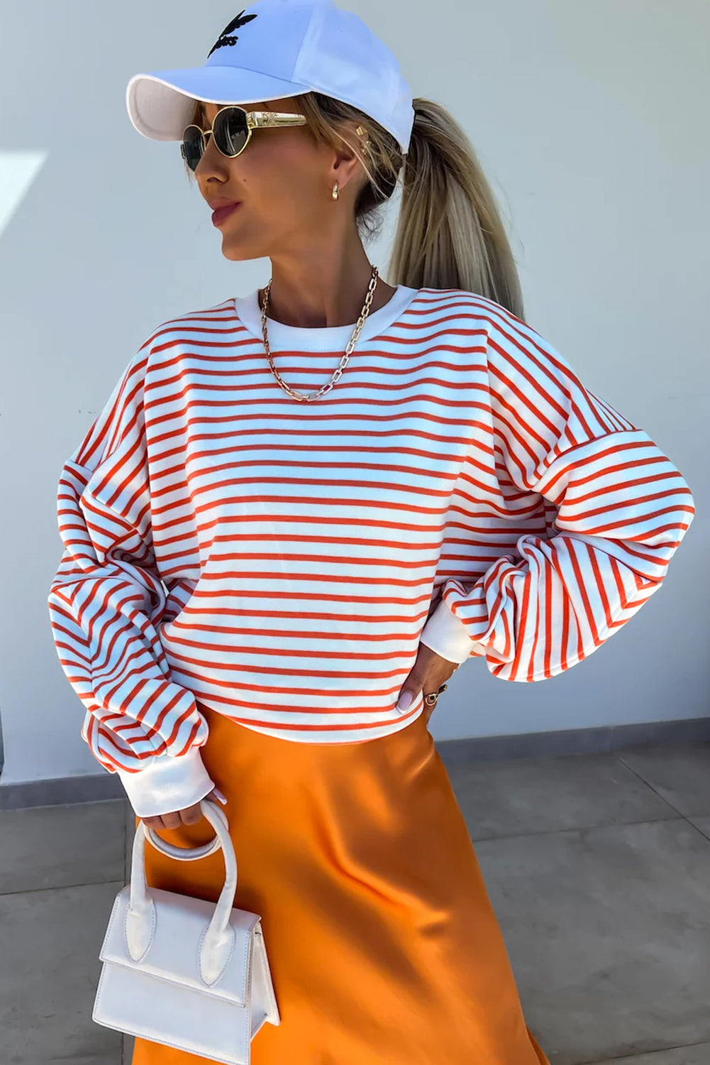 Orange stripe drop shoulder crew neck sweatshirt by ModestAndDevoted, featuring a loose fit and comfortable fabric blend.
