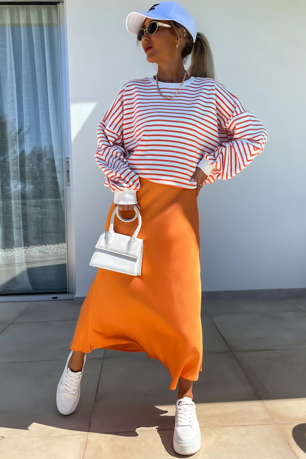 Orange stripe drop shoulder crew neck sweatshirt by ModestAndDevoted, featuring a loose fit, polyester-cotton blend, and stylish design.