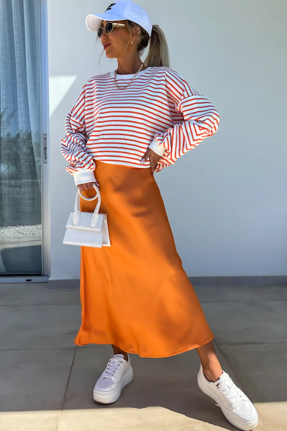 Orange stripe drop shoulder crew neck sweatshirt by ModestAndDevoted, featuring a loose fit and casual style.