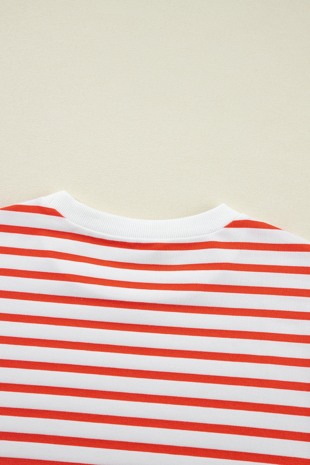 Orange stripe drop shoulder crew neck sweatshirt by ModestAndDevoted, featuring a relaxed fit, soft fabric blend of polyester, cotton, and elastane.