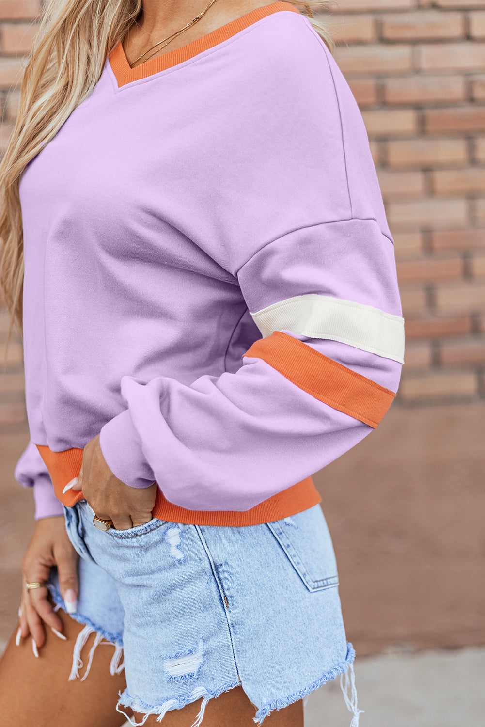 ModestAndDevoted orchid bouquet contrast rib knit patchwork drop shoulder V-neck sweatshirt in polyester and cotton.