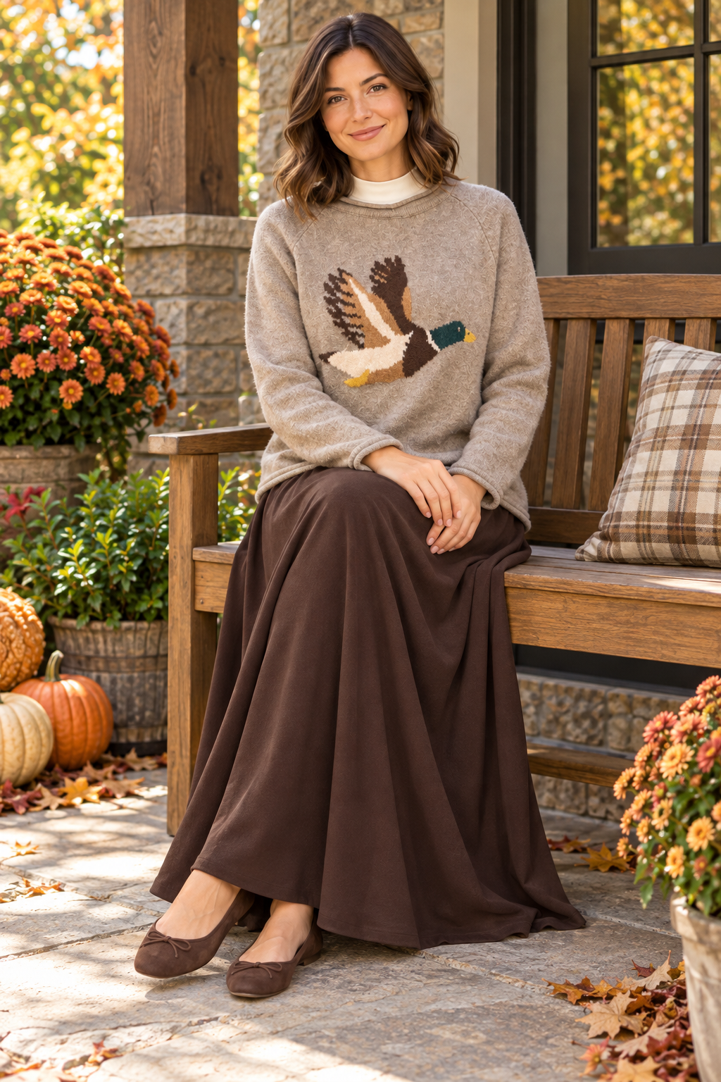 New'm Flying Mallard Duck Knit Sweater in Heather Taupe — seated lifestyle view