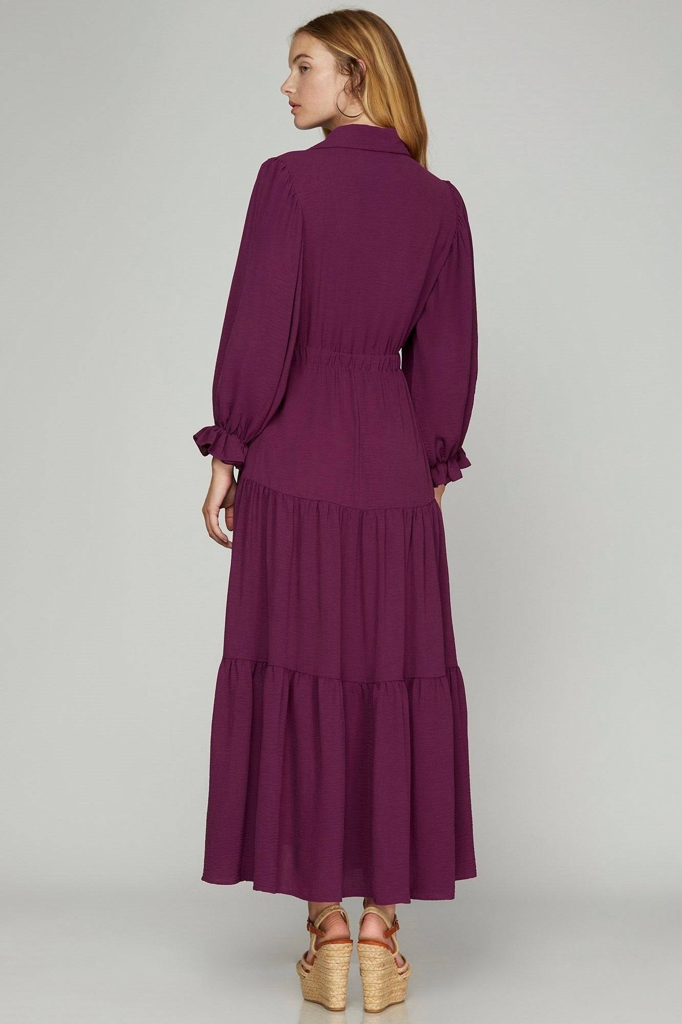 Purple collared maxi dress with puff sleeves and tiered design, featuring button-down front, perfect for elegant, casual wear.