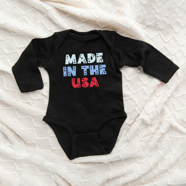 Pastel USA-themed baby long sleeve onesie by Olive & Ivory Wholesale, featuring comfortable fabric and all-age fit.
