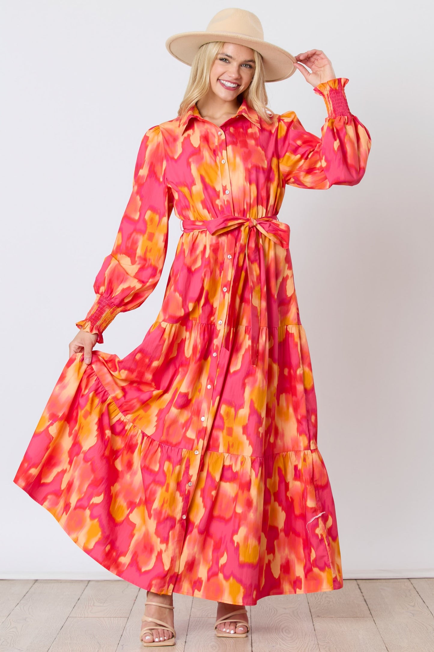 Magenta-orange brushed print shirt dress with tie waist from Peach Love California, featuring a relaxed fit and button-front design.