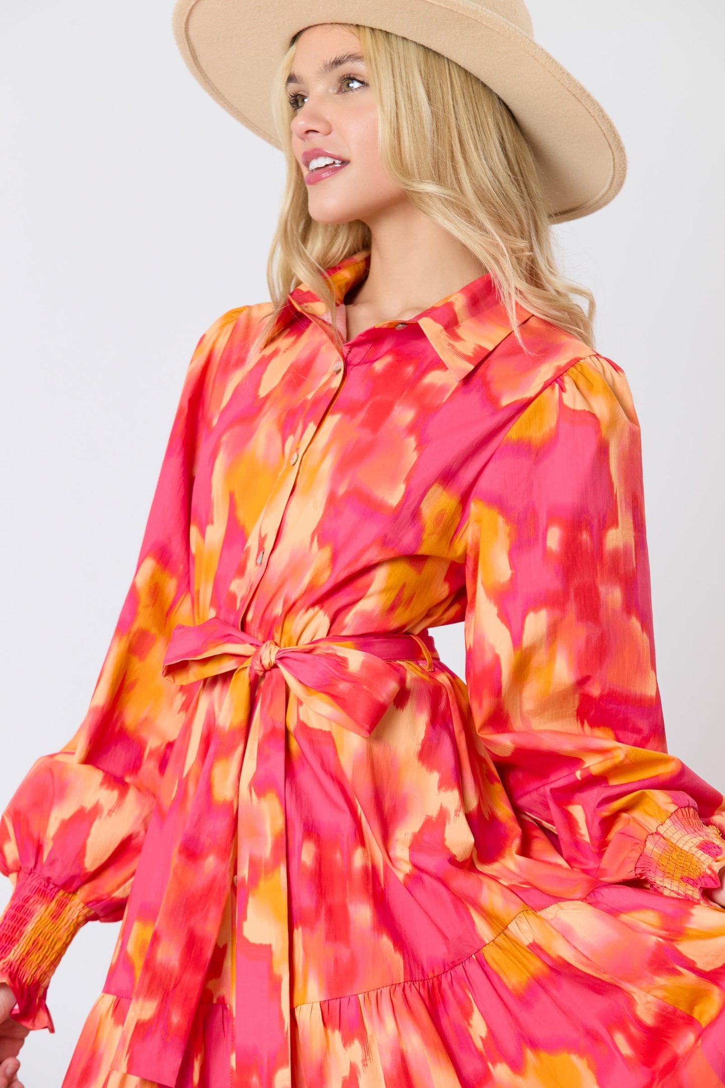 Magenta and orange brushed print shirt dress with tie waist by Peach Love California, featuring long sleeves and button-front design.