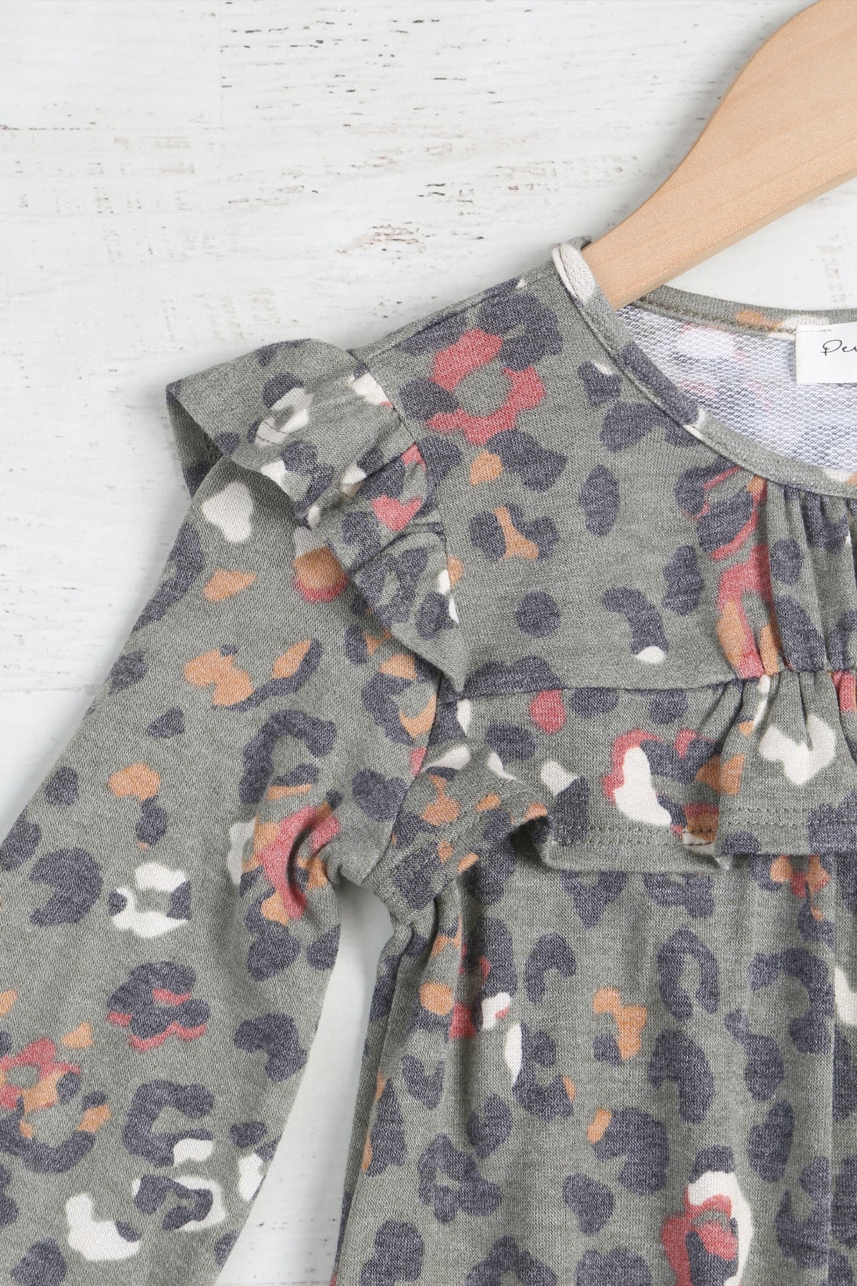 Girls' animal print tunic dress by Perfect Peach with shirring, ruffle details, long sleeves, and comfortable fit.