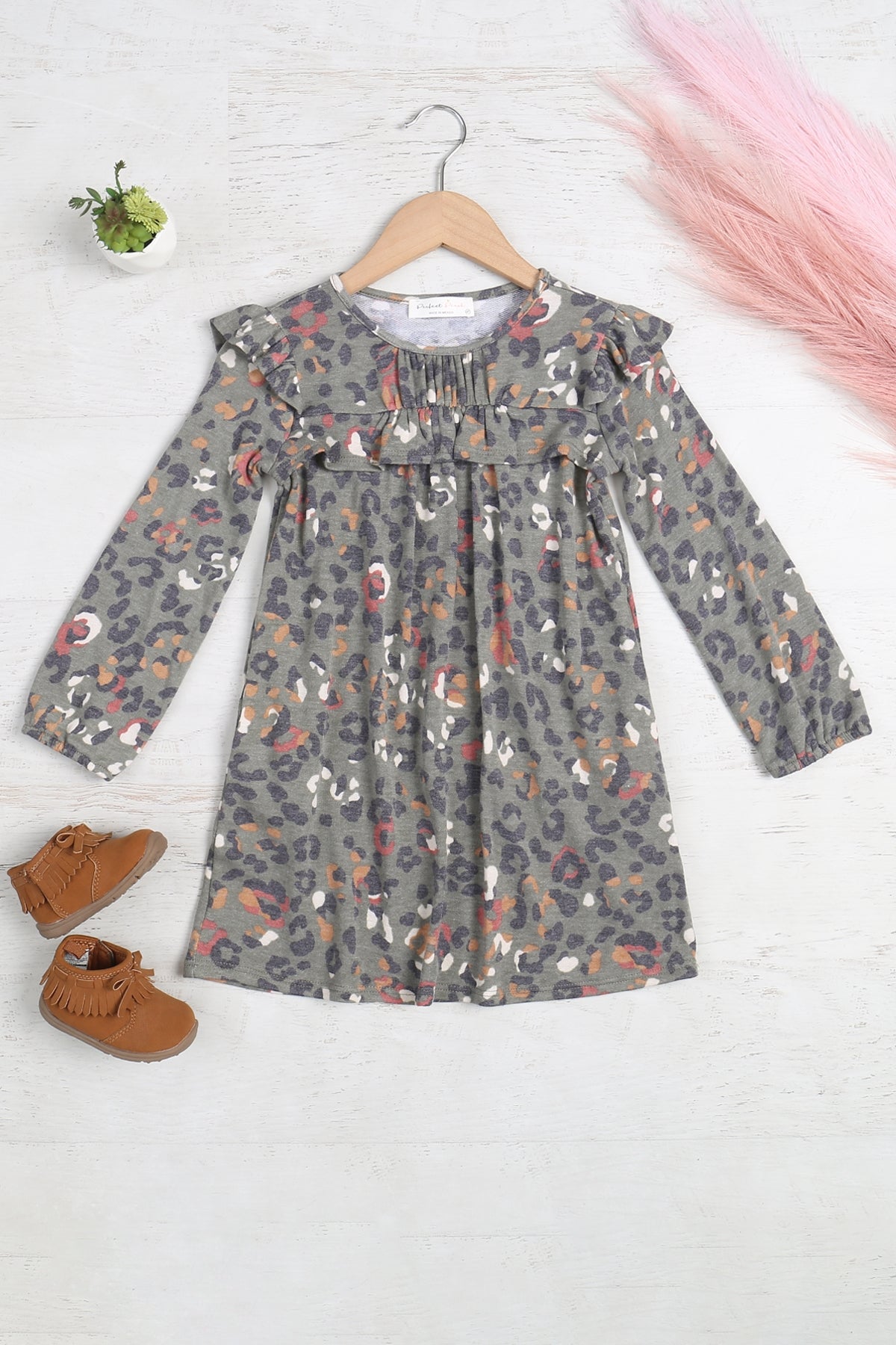 Girls' animal print long sleeve tunic dress with shirring and ruffle details by Perfect Peach, featuring a stylish and comfortable design.