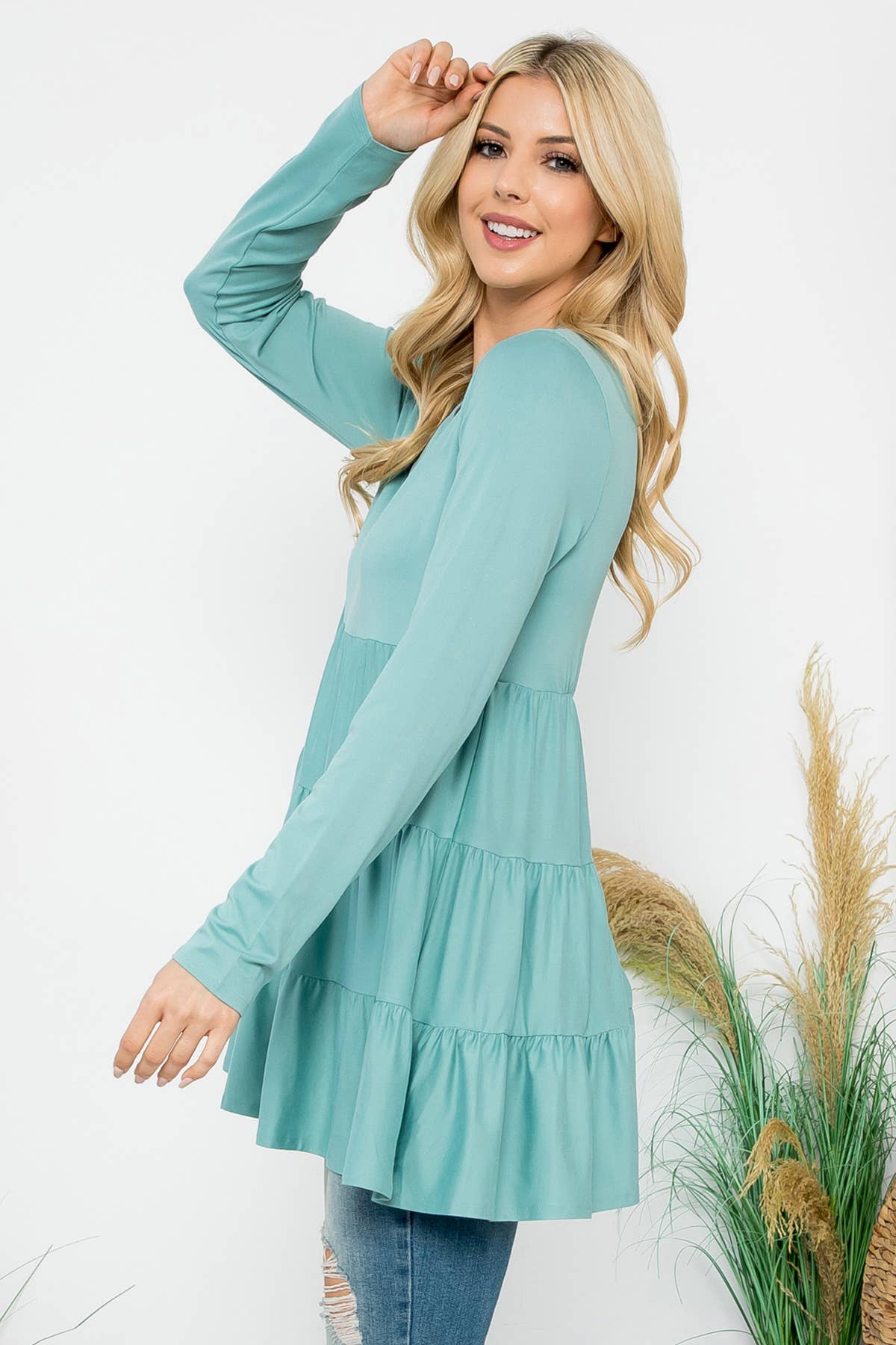 Cream-colored solid long sleeve tiered top by Perfect Peach, featuring a relaxed fit and subtle detailing.