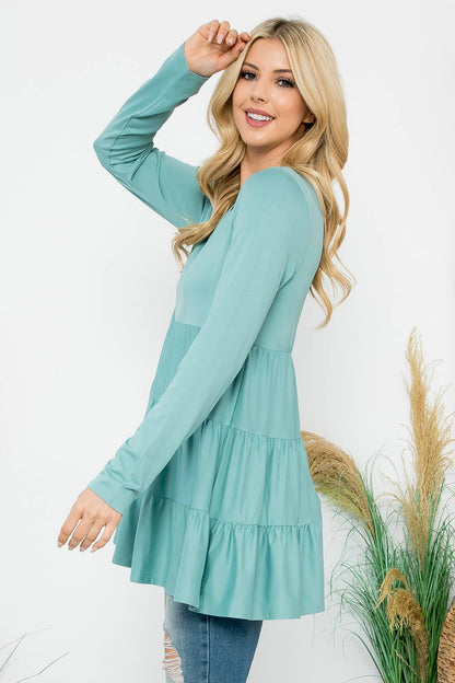Cream-colored solid long sleeve tiered top by Perfect Peach, featuring a relaxed fit and subtle detailing.