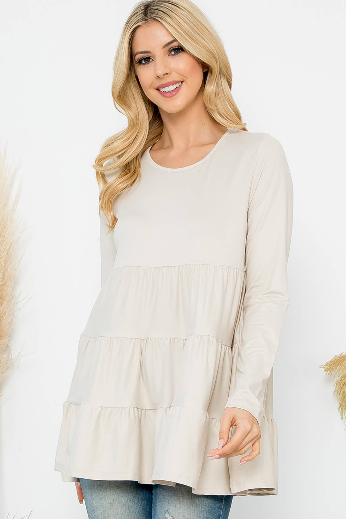 Cream-colored solid long sleeve tiered top by Perfect Peach, featuring a relaxed fit and stylish design.