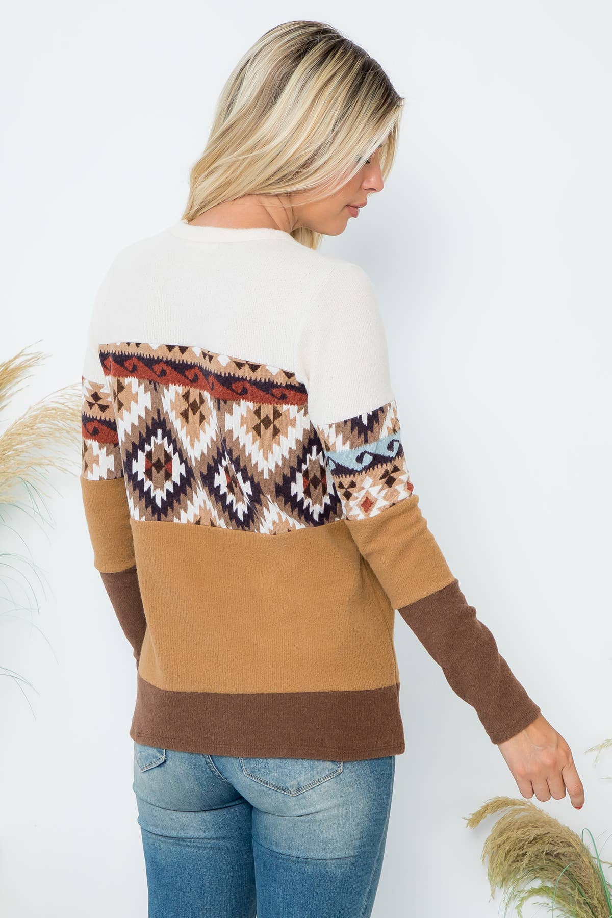 Perfect Peach long sleeve top with color block Aztec print and contrasting details, featuring a stylish and vibrant design.