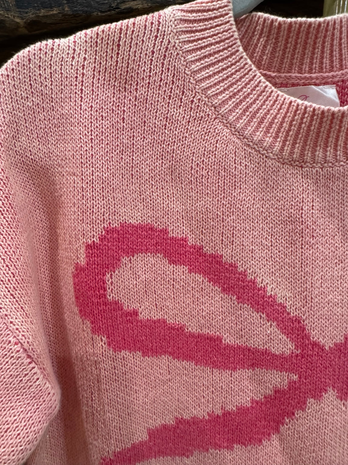 Pretty in Bows pink mineral wash cotton sweater bow knit detail