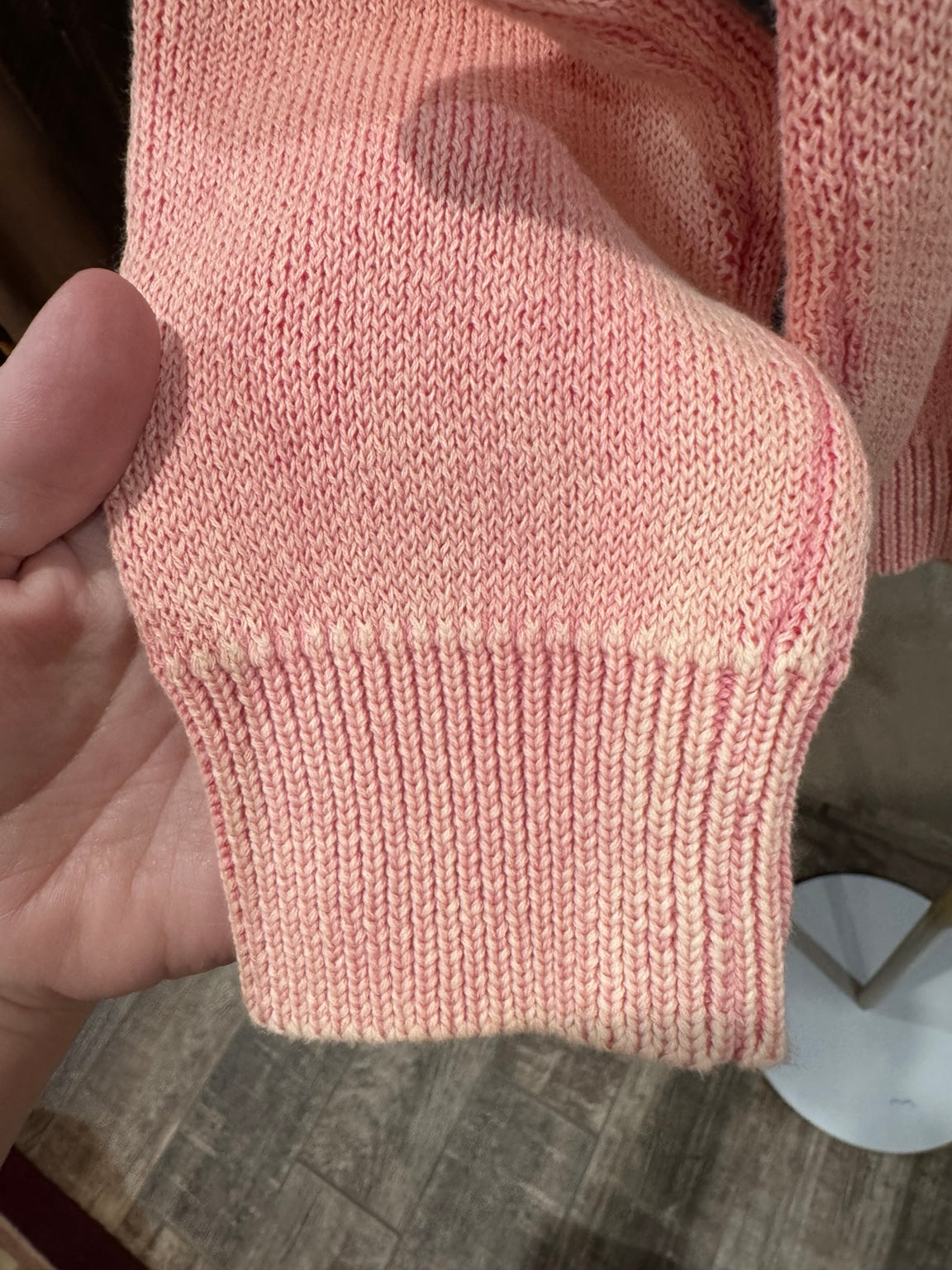 Pretty in Bows pink mineral wash cotton sweater ribbed cuff detail