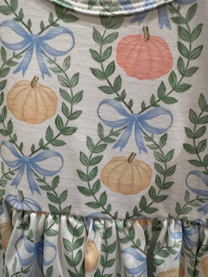 Pastel pumpkin and blue bow print detail