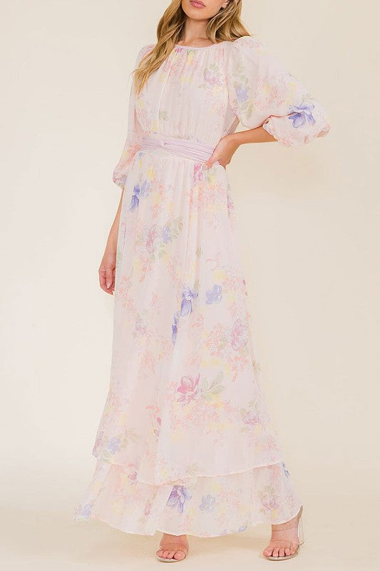 Soft pink pastel floral chiffon maxi dress by Rousseau, flowing fabric with delicate floral patterns, perfect for elegant occasions.