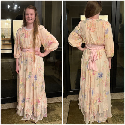 Soft pink pastel floral chiffon maxi dress by Rousseau featuring a flowing design and elegant floral pattern.
