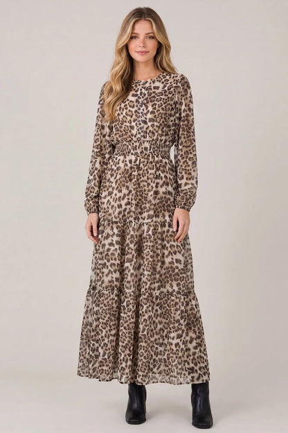 Long sleeve animal print tiered maxi dress with pockets by She and Sky, featuring a flowing design and stylish pattern.