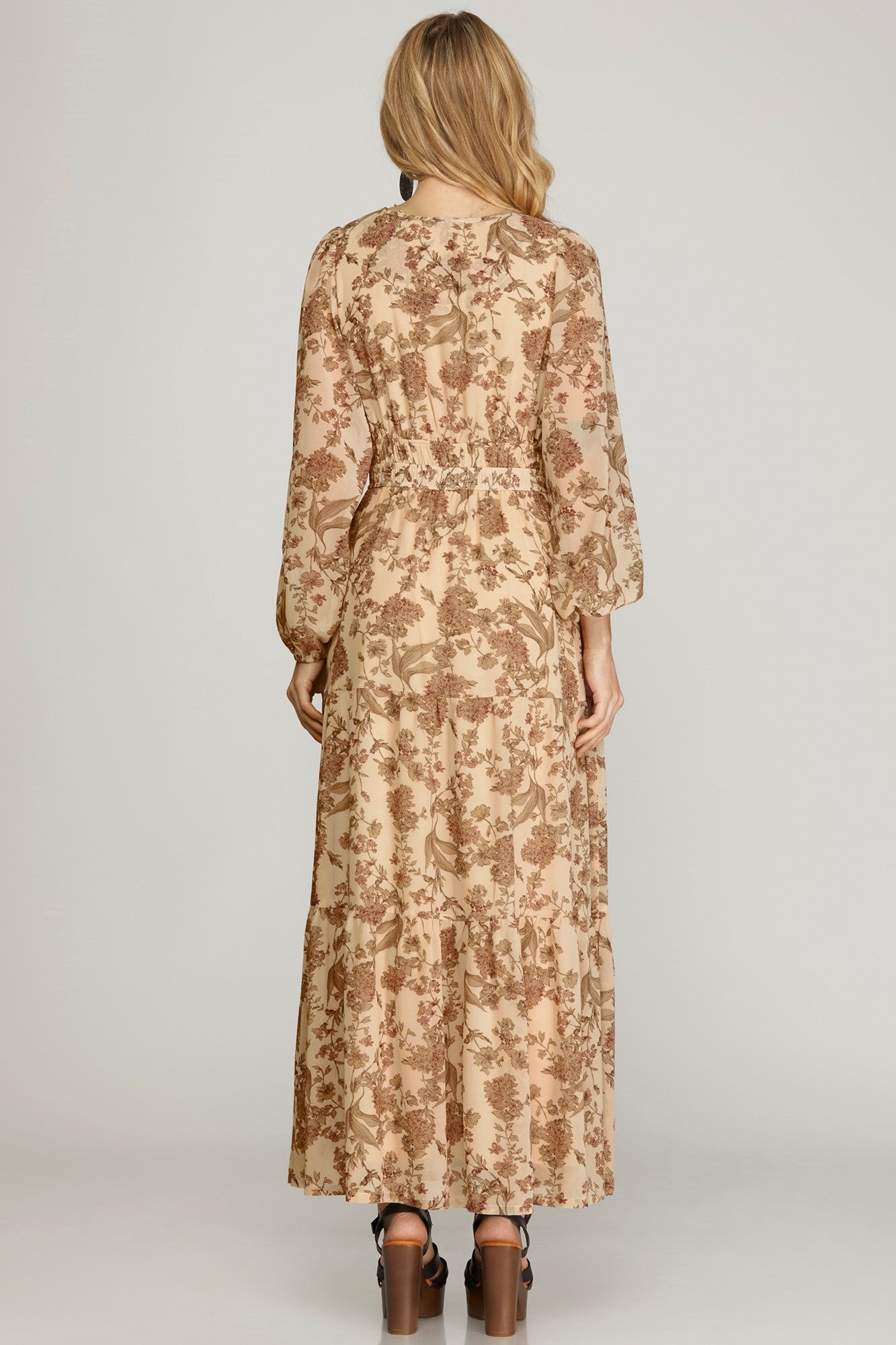 Plus printed tiered maxi dress in black by She+Sky, featuring a flowing silhouette and tiered design, perfect for elegant casual wear.