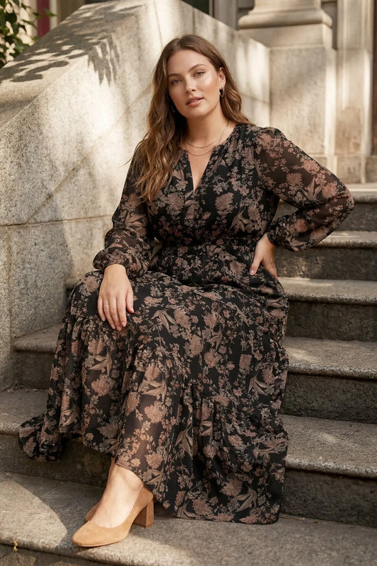 Plus printed tiered maxi dress in black by She+Sky, featuring flowing fabric and a stylish tiered design.