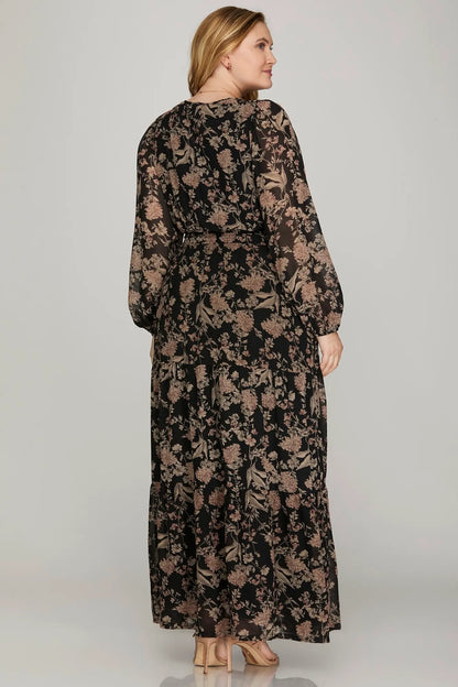 Plus printed tiered maxi dress in black by She+Sky, featuring flowing fabric and elegant layered design.