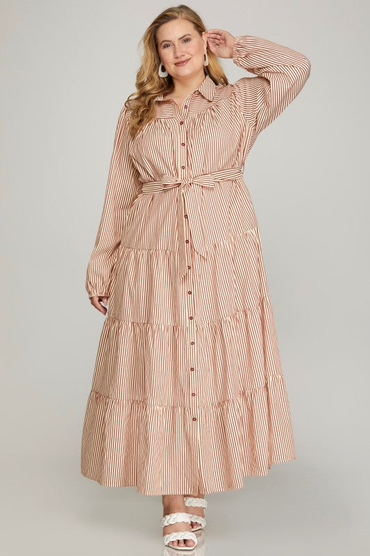 Plus Striped Perfection Maxi Dress from She+Sky in cinnamon, featuring a flowing design and bold striped pattern.