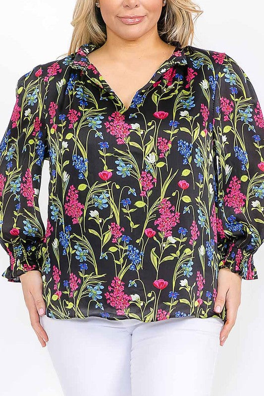 Long sleeve floral blouse with ruffle V-neck from Sugarless, vibrant colors, lightweight fabric, and feminine design.