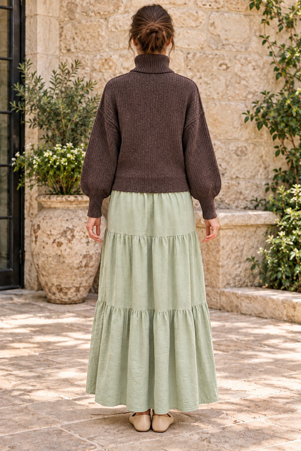 Timing deep brown heathered turtleneck sweater worn with sage maxi skirt, back view