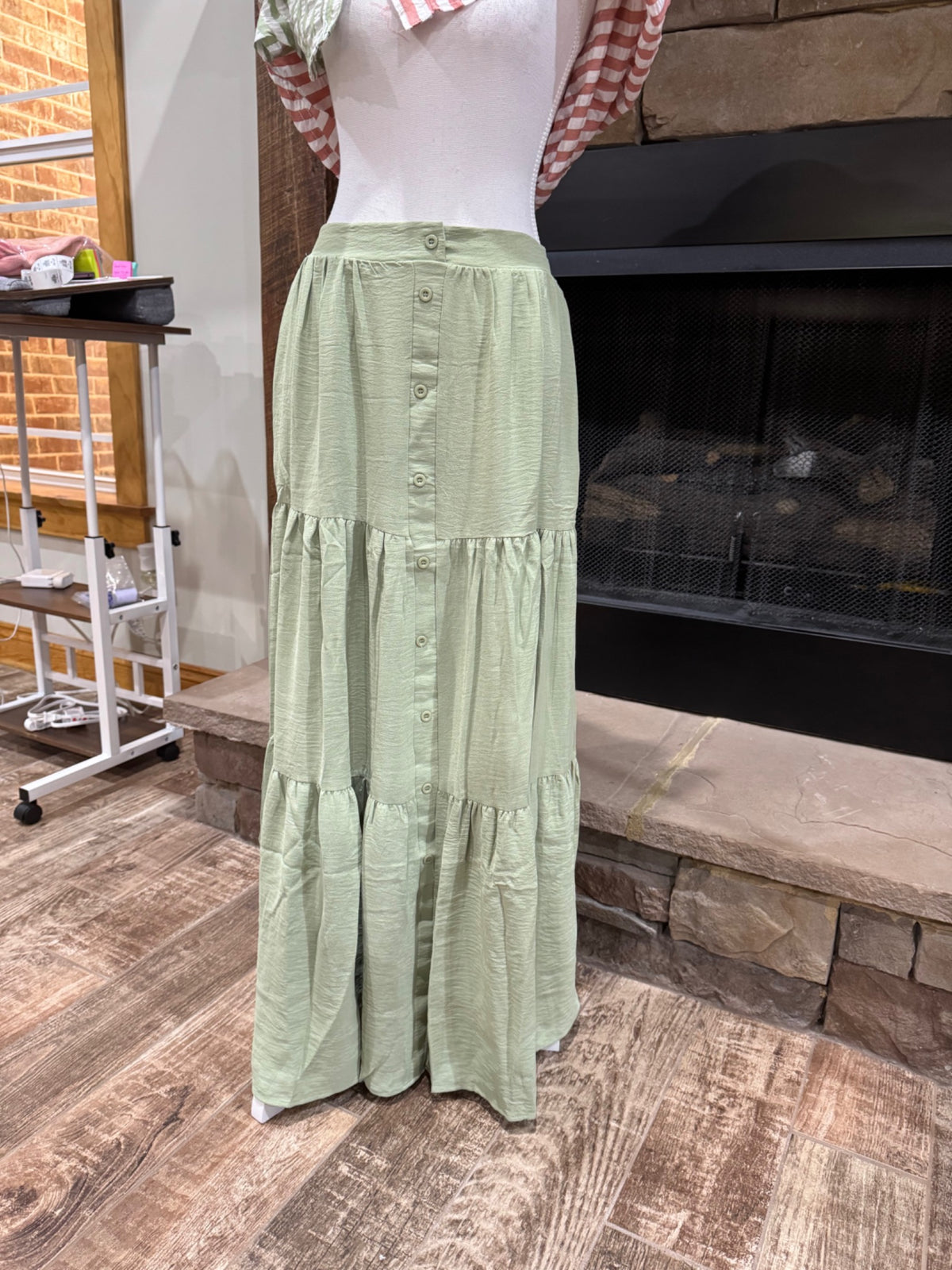Timing sage green tiered maxi skirt with faux button placket, front view