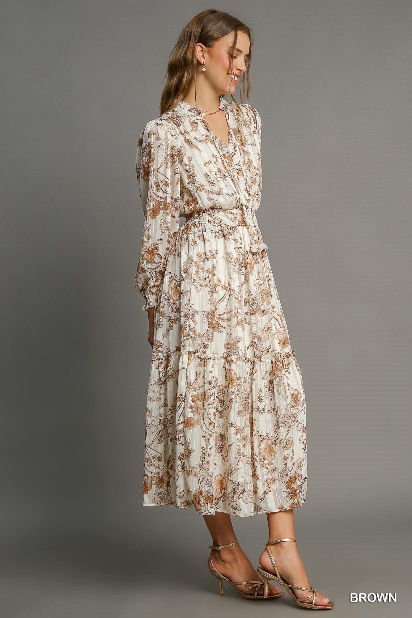 Lurex floral print tassel tie dress by Umgee featuring a vibrant pattern, lightweight fabric, and stylish tie detail.