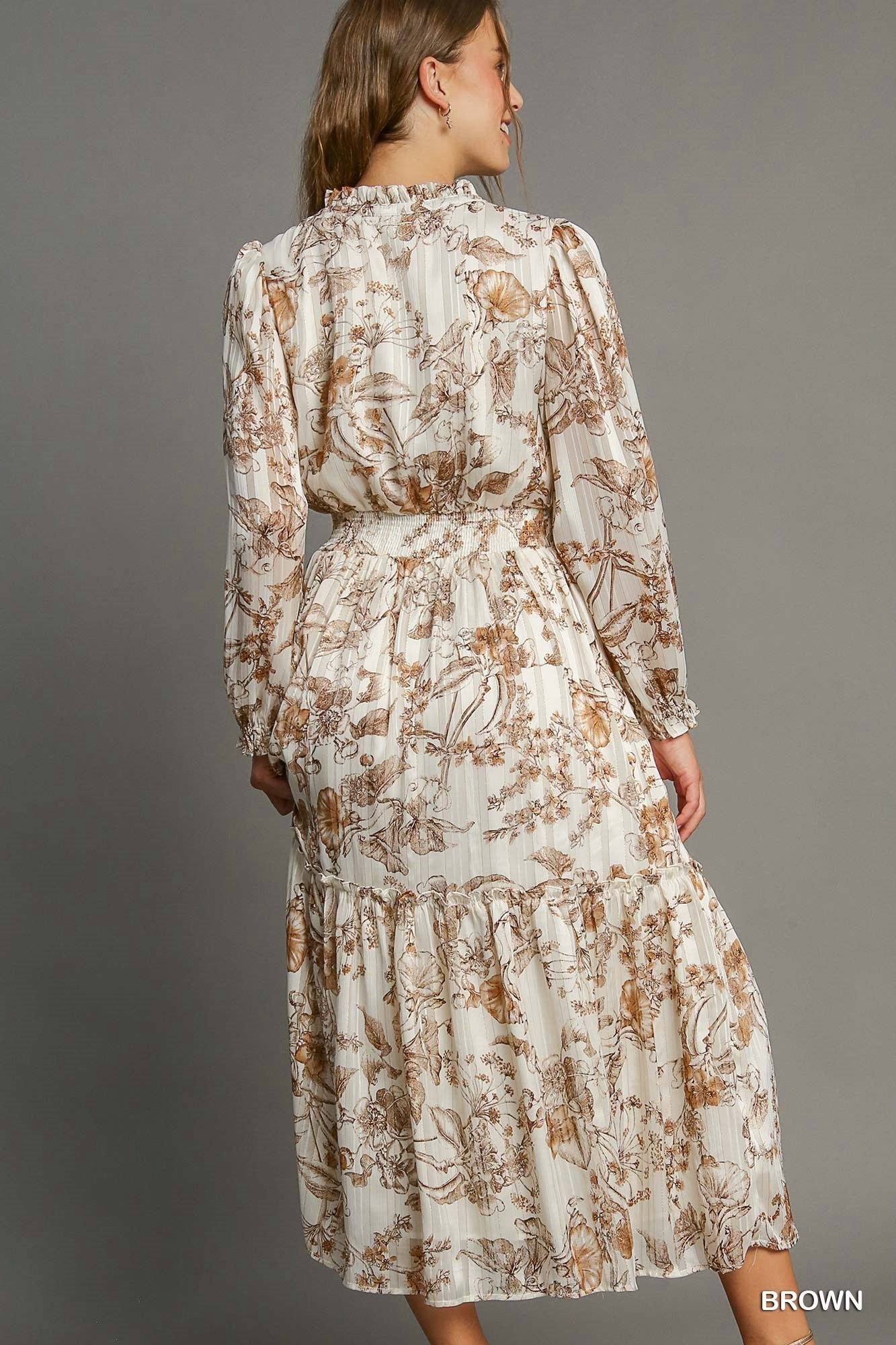 Umgee floral print tassel tie dress with lurex accents, featuring a relaxed fit and stylish design.