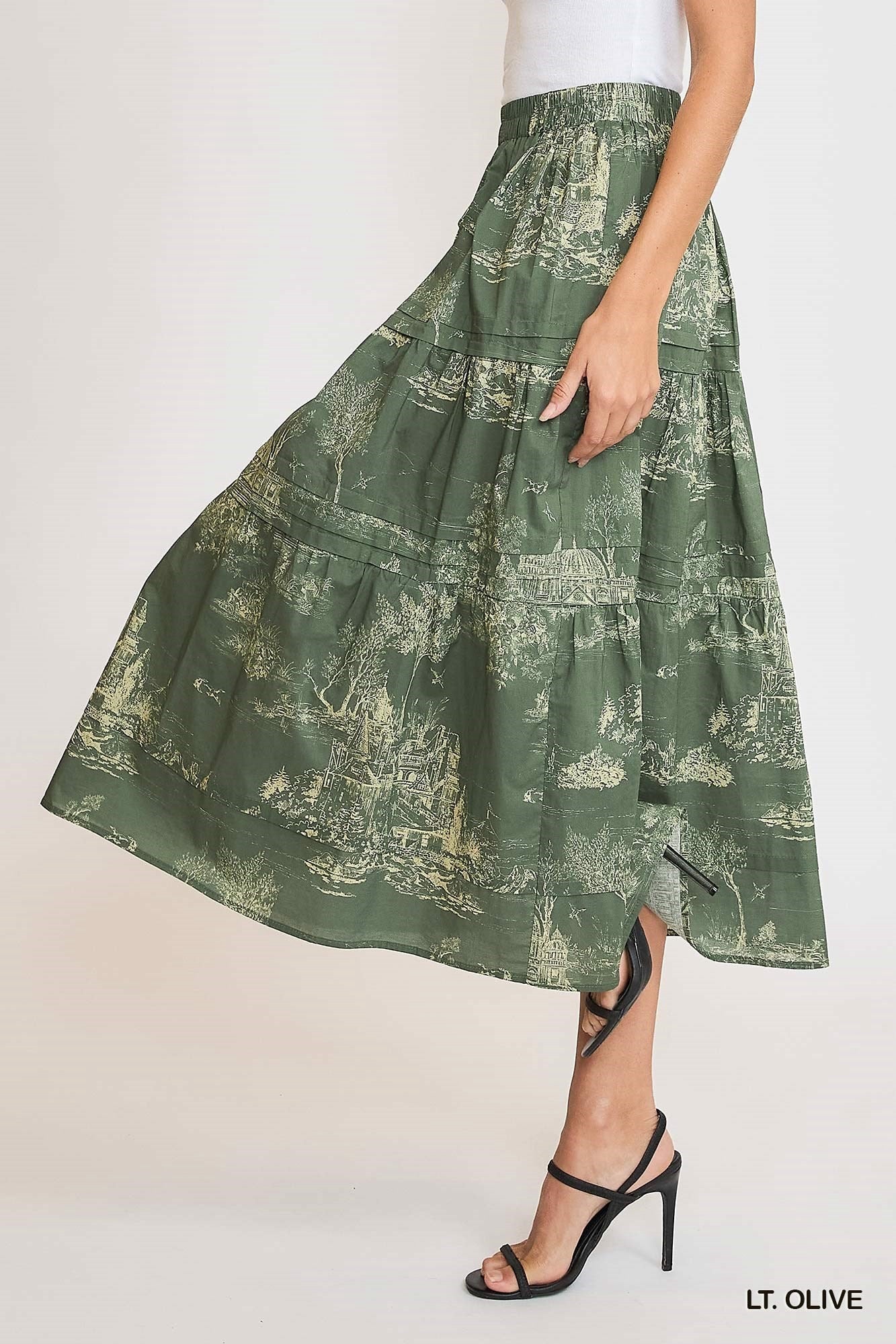 Olive green toile pintuck maxi skirt by Umgee, featuring a flowy silhouette and pintuck details, perfect for versatile seasonal wear.