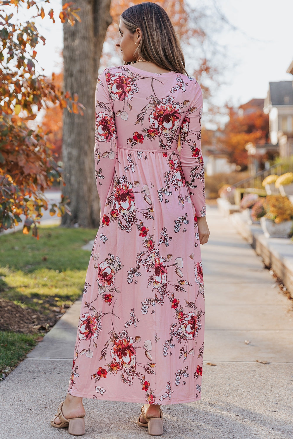 Pink faux wrap empire maxi dress, flowy fabric with a flattering wrap design, sleeveless style, suitable for summer or special occasions.
