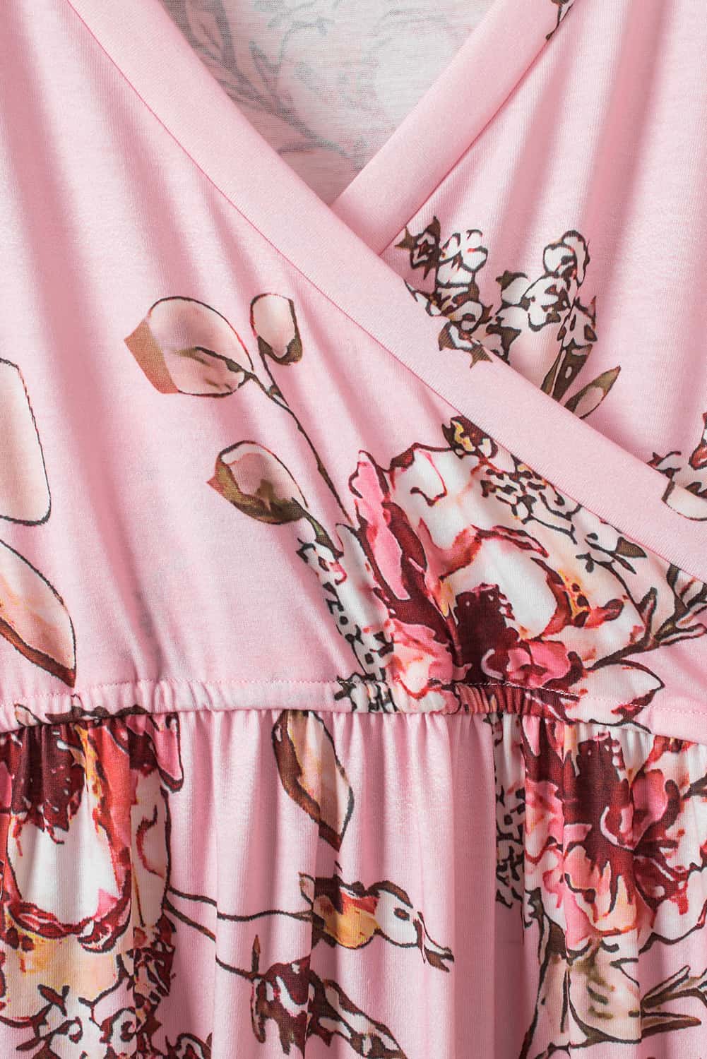 Pink faux wrap empire maxi dress with a flowing silhouette, featuring a V-neckline and long sleeves perfect for elegant occasions.